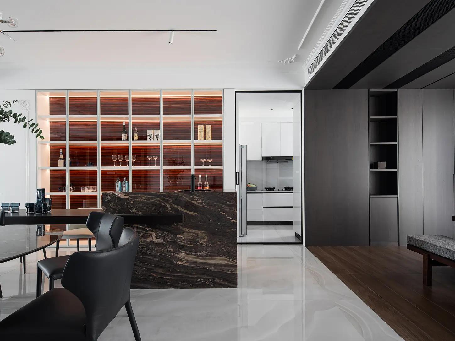 Bespoke built-in dining cabinet with refined wood veneer panels and tailored interior fittings